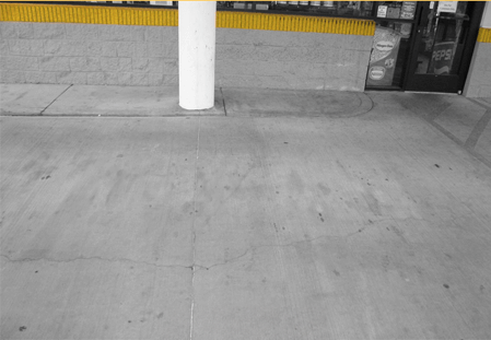 The same concrete area after EXIMO treatment with staining visibly reduced